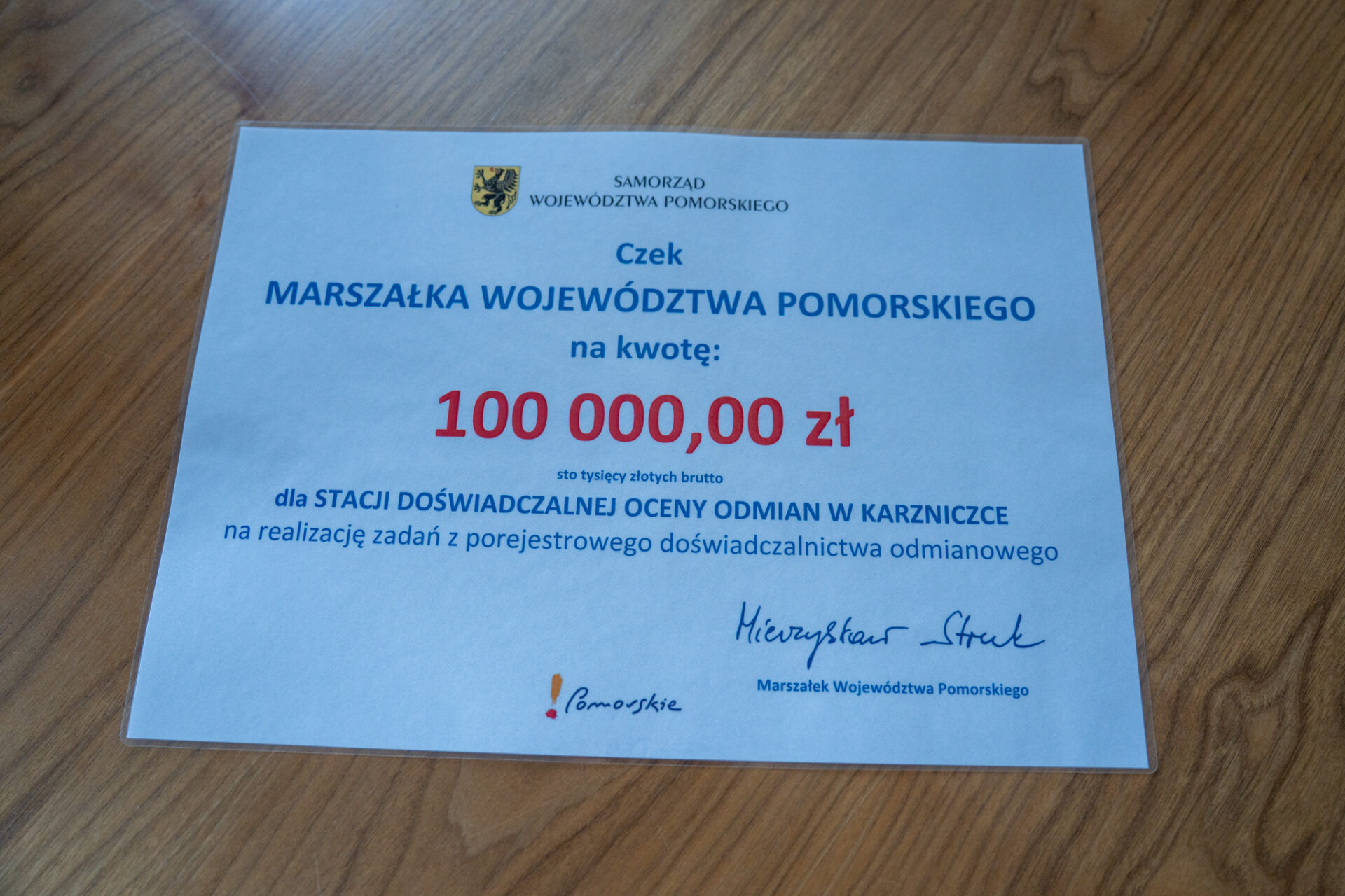czek na 100 tys. zł